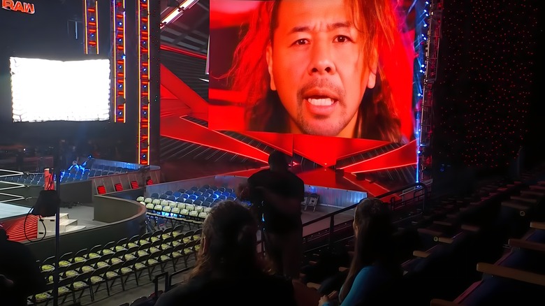 Sami Zayn watches Shinsuke Nakamura on a screen