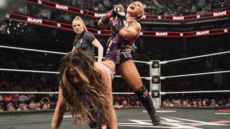 Ivy Nile applying an ankle lock to Dakota Kai in the ring on "WWE Raw"