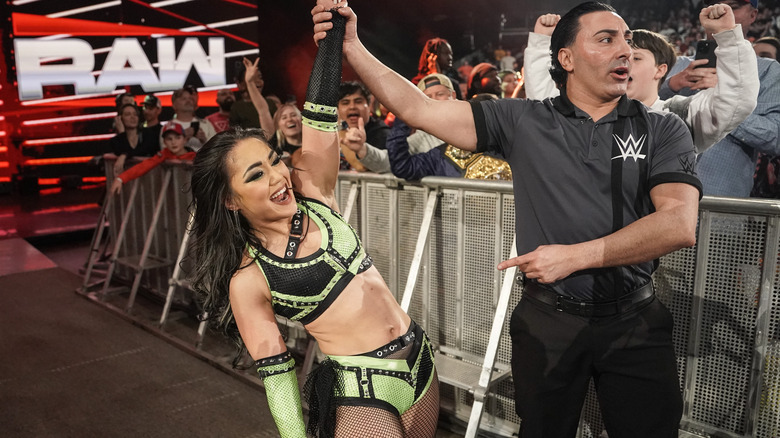 Referee raises Roxanne Perez' hand after her victory on "WWE Raw"