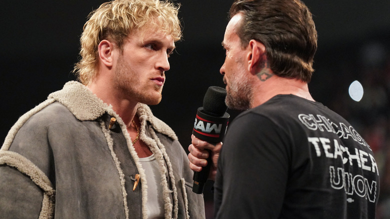 CM Punk speaking on the mic to Logan Paul on "WWE Raw"