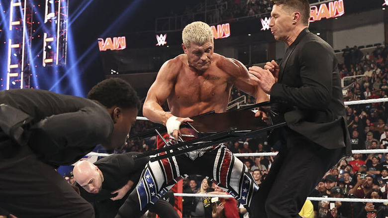 Cody Rhodes fights off three goons