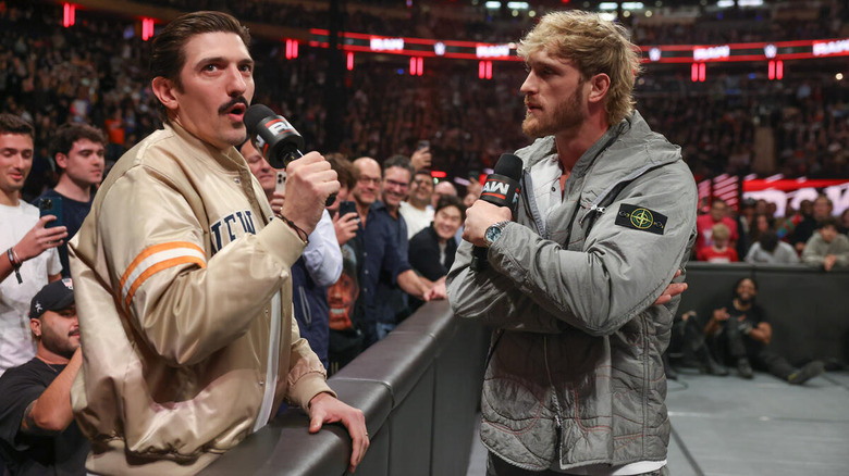 Logan Paul exchanges words with Andrew Schulz at ringside on "WWE Raw"