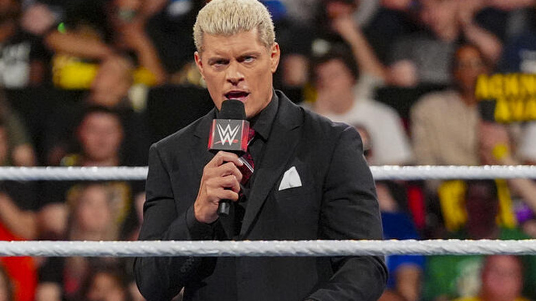 Cody Rhodes with a microphone