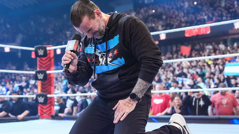 CM Punk pounds mic against his forehead