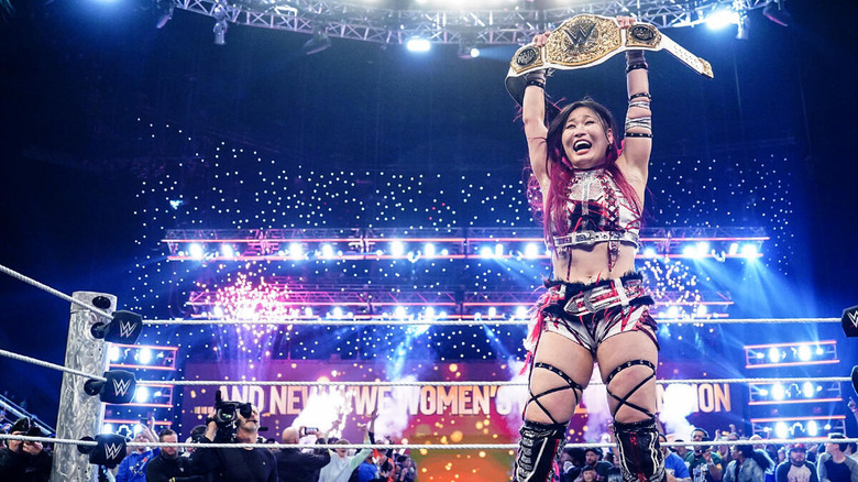 IYO SKY raises the Women's World Championship as fireworks go off on "WWE Raw"