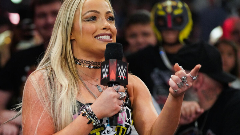 Liv Morgan smiling and pointing