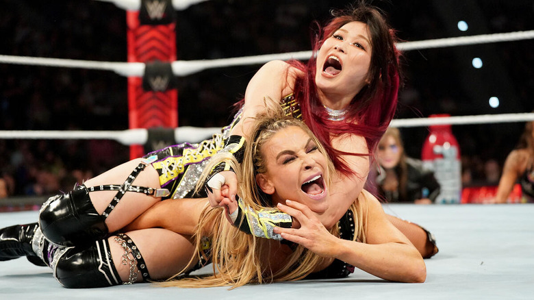 IYO SKY with Natalya in a submission hold