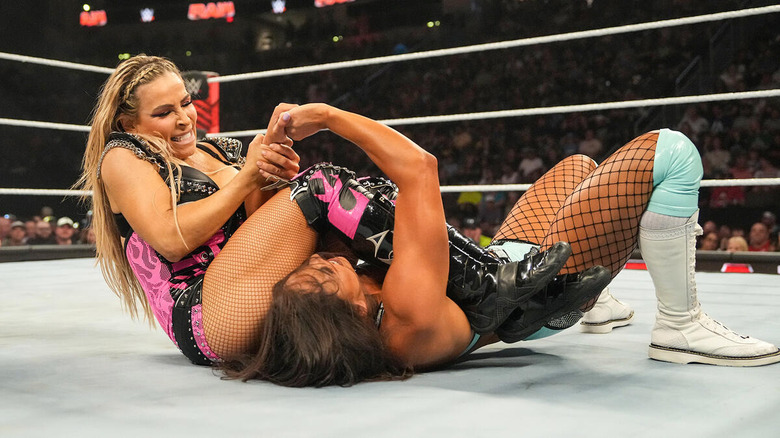 Natalya getting Kiana James in a submission hold