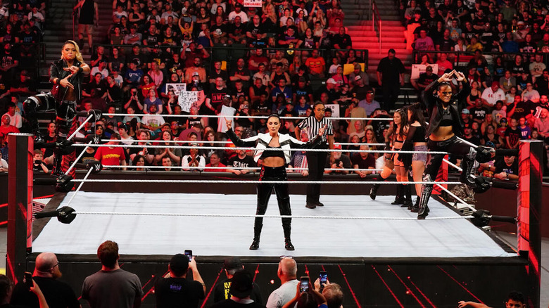 Zoey Stark, Sonya Deville, and Shayna Baszler posing