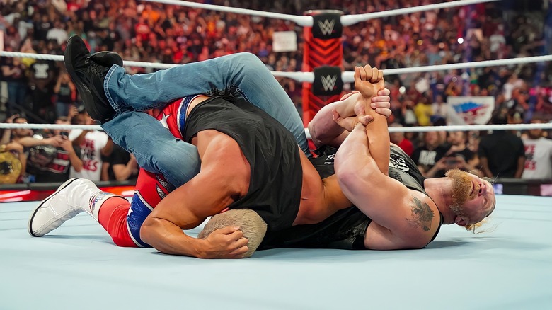 Brock Lesnar with Kimura Lock on Cody Rhodes