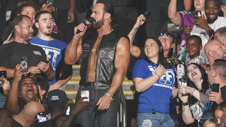 Drew McIntyre in crowd with microphone