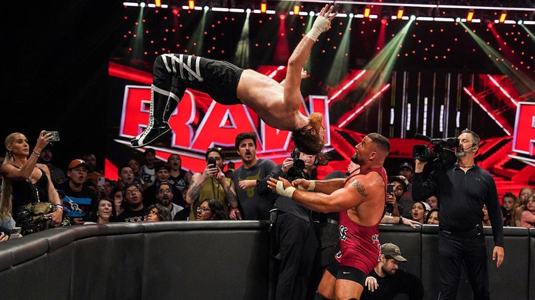 Sami Zayn backflipping onto Bron Breakker