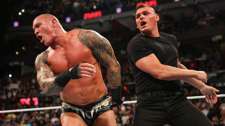 GUNTHER punching Randy Orton