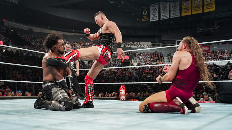 Miz kicking Xavier Woods and Pete Dunne