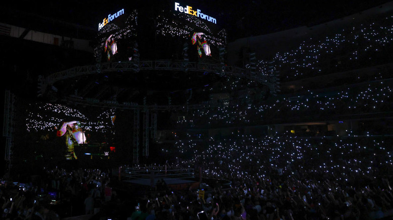 The audience lights up in tribute to Bray Wyatt