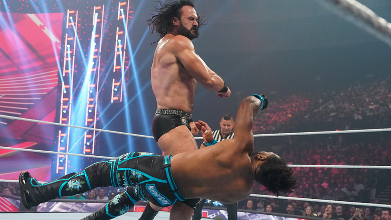 Drew McIntyre knocks down Xavier Woods