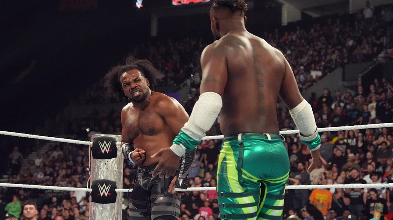 Xavier Woods angrily pointing at Kofi Kingston