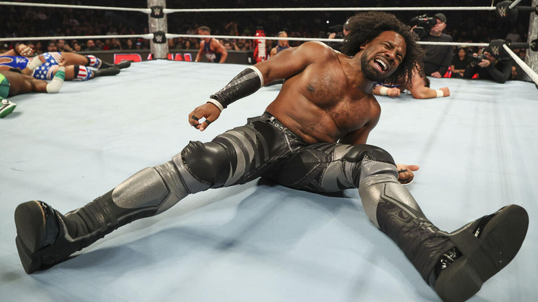 Xavier Woods in pain on the mat