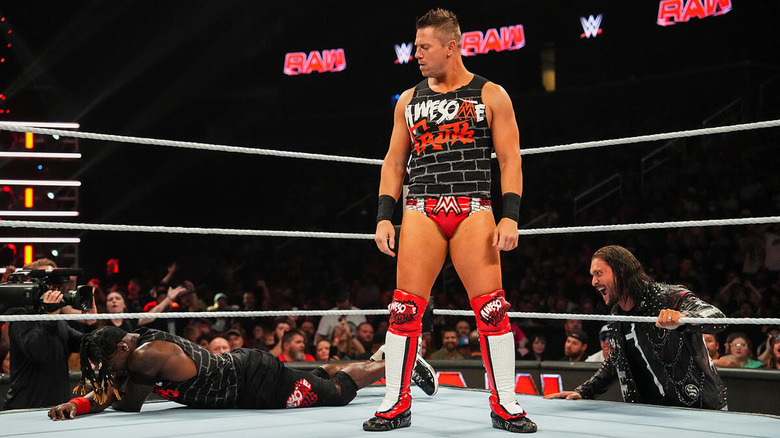 The Miz looks down on R-Truth while Karrion Kross laughs