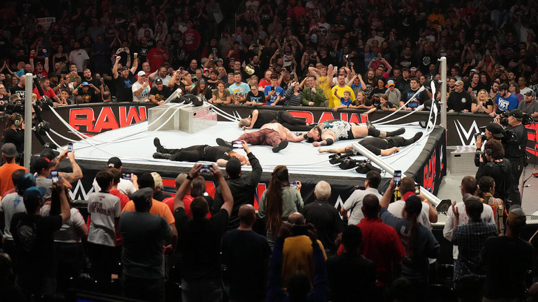 The collapsed ring with Braun Strowman and Bronson Reed lying on it