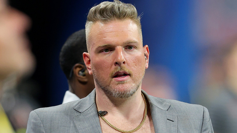 Pat McAfee wearing a gray suit