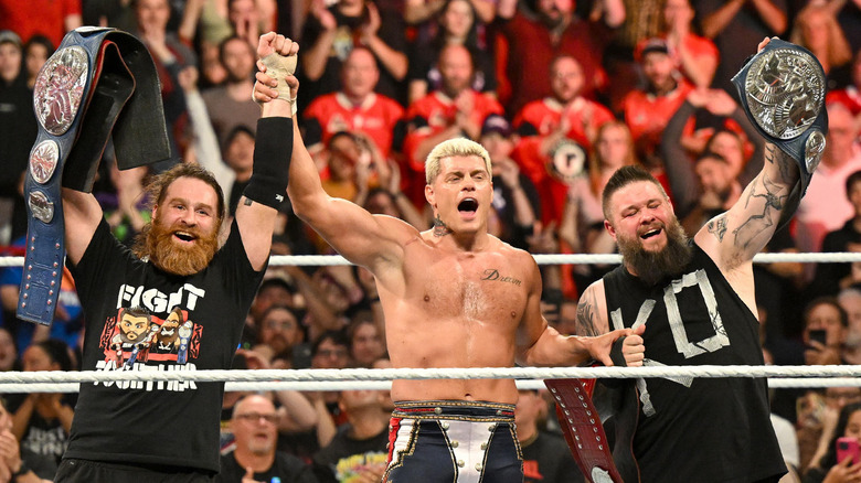 Cody Rhodes, Sami Zayn & Kevin Owens celebrate after main event