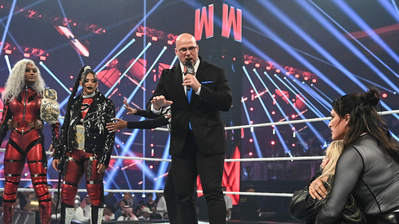 Adam Pearce (C) speaks to Jade Cargill, Bianca Belair (L), Liv Morgan, Raquel Rodrigues (R) during Monday Night RAW at Mohammed Abdo Arena on November 4, 2024 in Riyadh, Saudi Arabia.