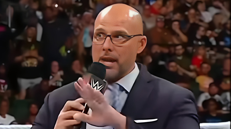 WWE Raw GM Adam Pearce speaks into microphone