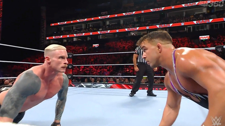 Gable and Lumis staring one another down in the ring