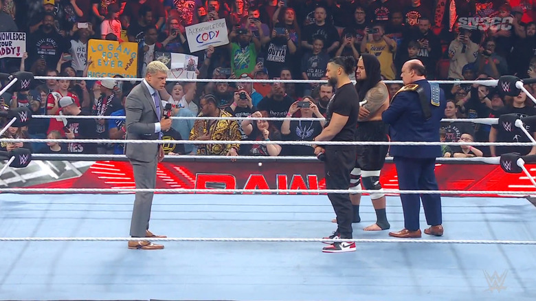 Reigns, Sikoa, and Heyman facing off with Rhodes