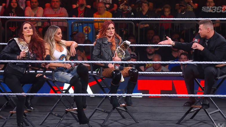 Lynch, Lita, and Stratus in the ring