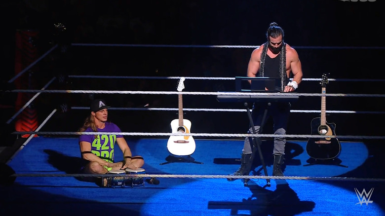 Elias playing as Riddle watches on 