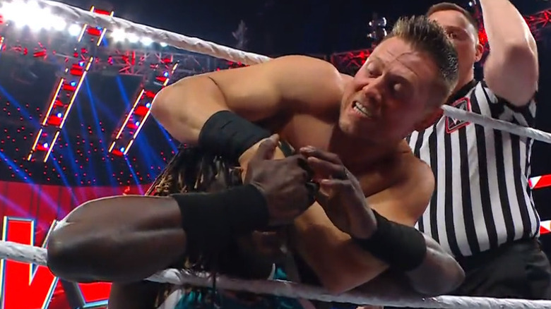 Miz pulling at Truth's jaw