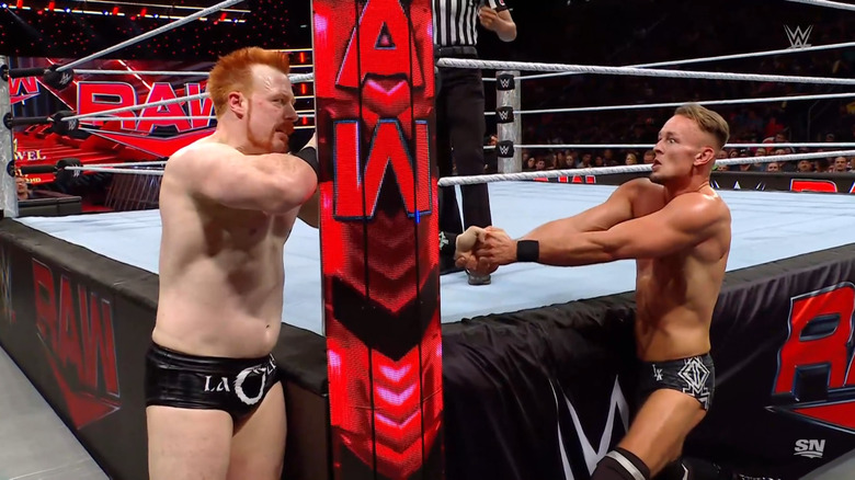 Sheamus and Kaiser brawling near the ring post