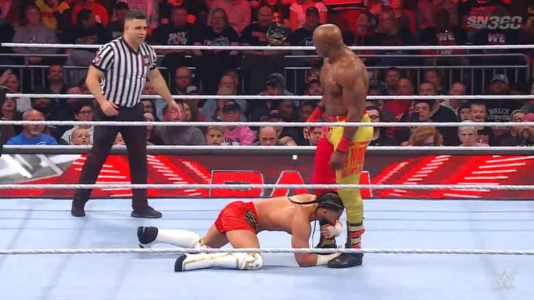 Lashley standing over Ali