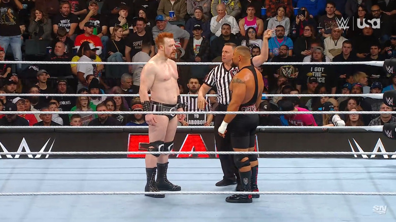 Sheamus and Breakker staring each other down in the ring