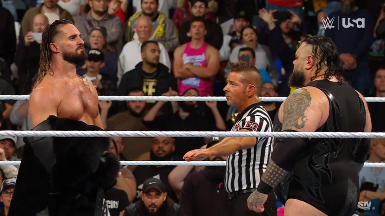 Rollins and Reed staring each other down in the ring