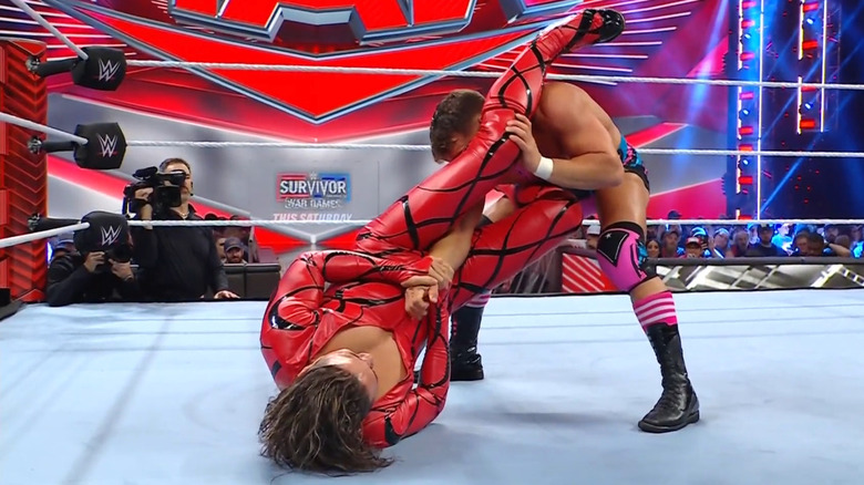 Nakamura with Gable in a submission hold