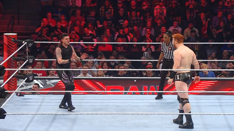 Mysterio backing away from Sheamus