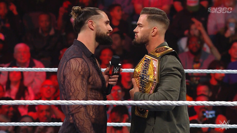 Theory and Rollins facing off in the ring