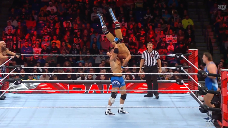 Julius with Gargano in a vertical suplex position