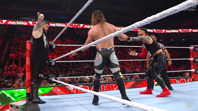 Rollins tagging in Owens