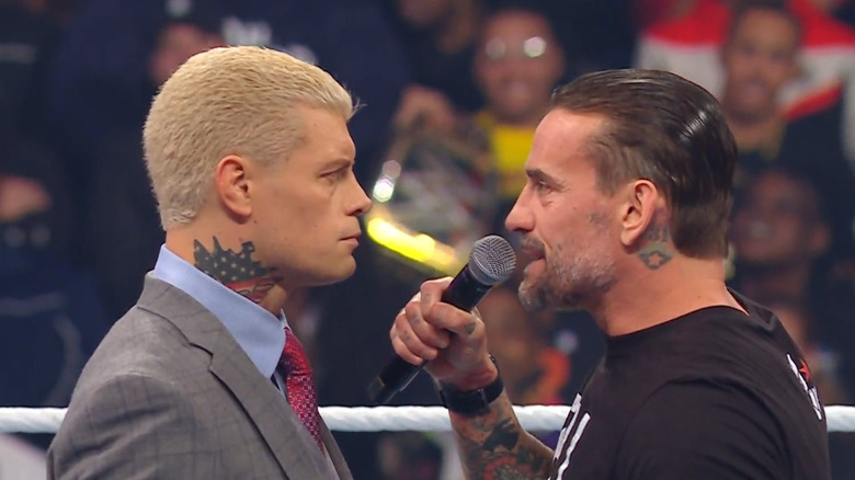 Cody and Punk in the ring