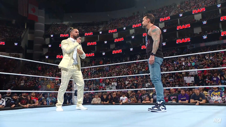 Rollins and Punk inside the ring