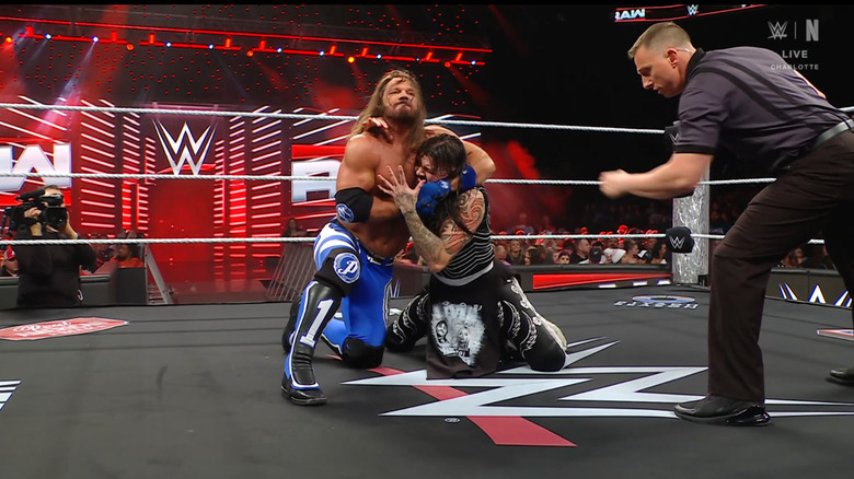 Styles wearing down Dominik with a submission