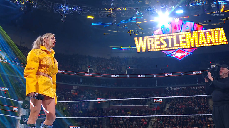 Flair in the ring under the WrestleMania sign