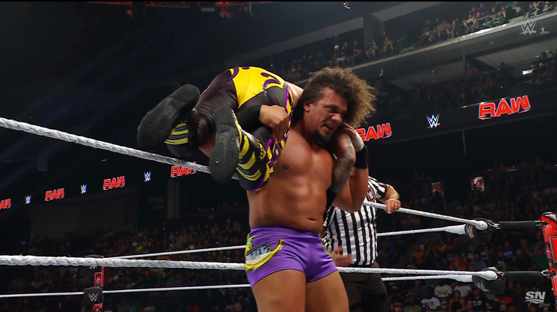 Carlito with Rey on his shoulders