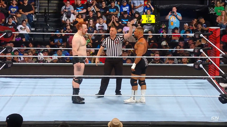 Sheamus and Breakker staring one another down