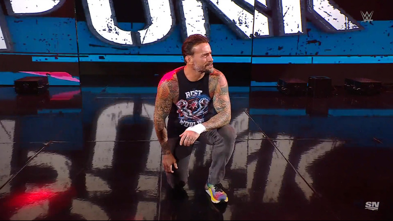 Punk kneeling on the entrance ramp