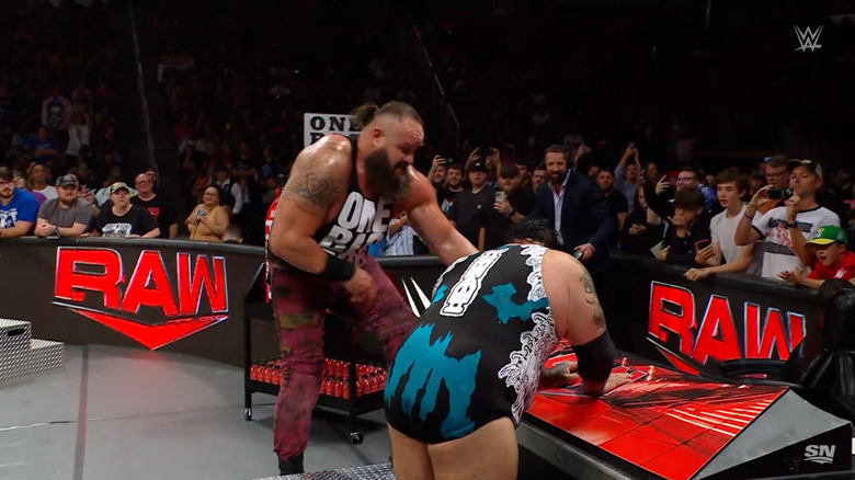 Reed and Strowman brawling on the outside